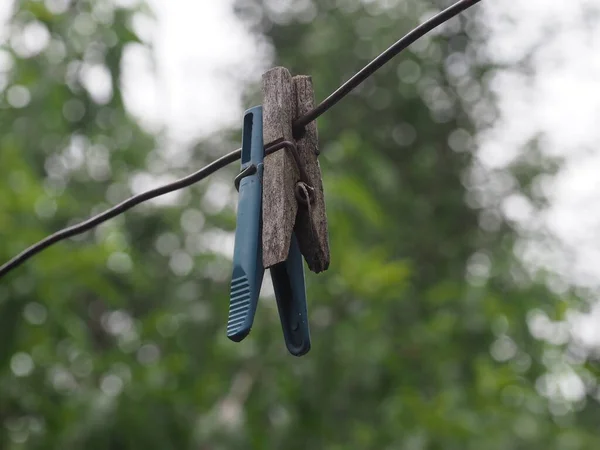 old clothespins on a wire in a country yard for drying clothes