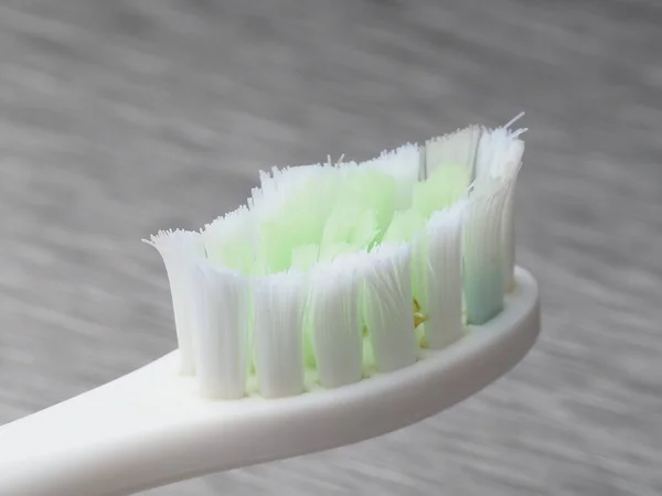 Old White Toothbrush White Green Bristles Metal Background — Stock Photo, Image
