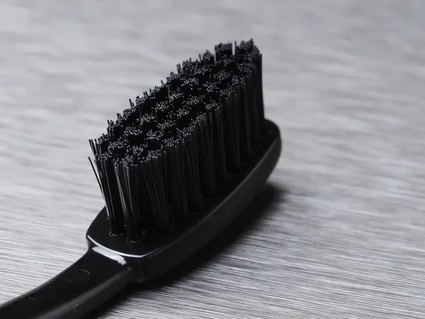 Black Toothbrush Black Bristles Metal Background Close — Stock Photo, Image