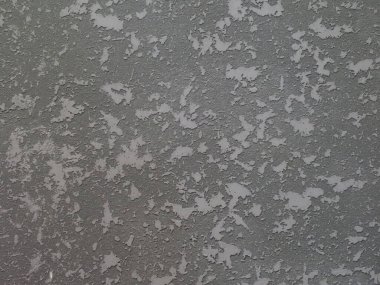 Desenli gri soyut duvar, yakın plan.