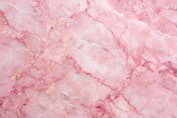 Texture of pink marble with golden veins