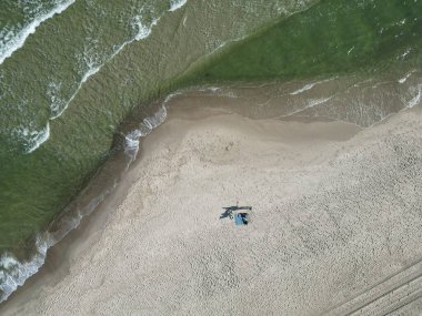 Aerial Shot of Deserted Sandy Beach with Scenic Sea Waters and Sand Textures clipart