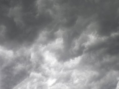 Atmospheric dark gray storm with dramatic clouds in the sky creating a gloomy and anxious mood before the thunderstorm clipart