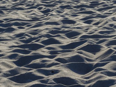 Gün batımında Sandy Sahili 'nde Gölgeler ve Dokularla Rüzgâr Örnekleri' nin yakın çekimi