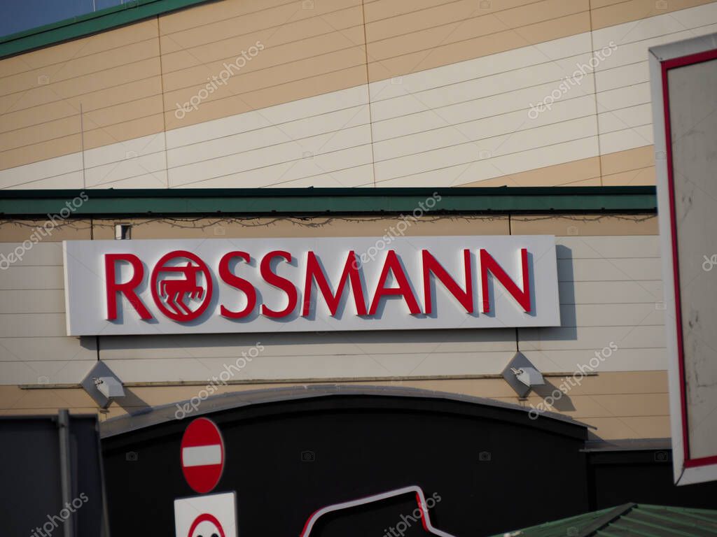 Illuminated Rossmann Drugstore Storefront Sign at Shopping Mall Entrance in Central Europe
