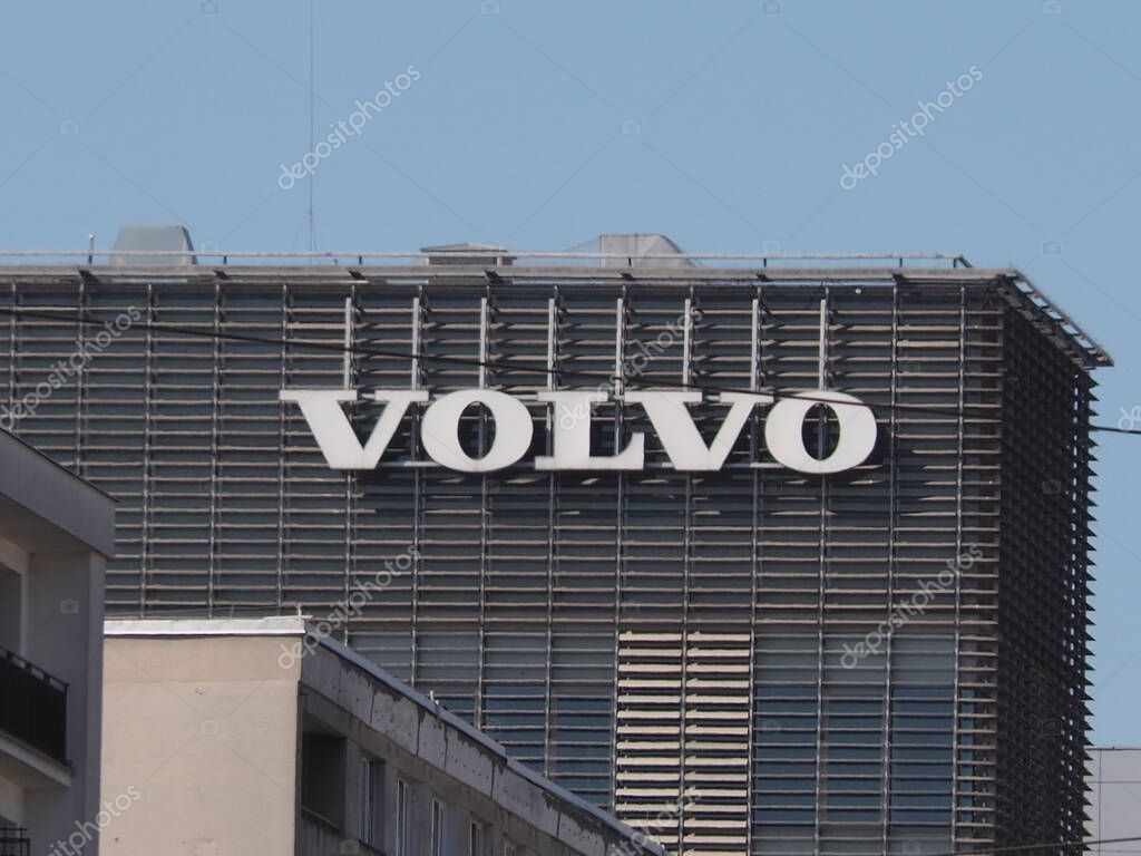 Volvo Corporate Building with Modern Architectural Design and Large Logo Against Blue Sky