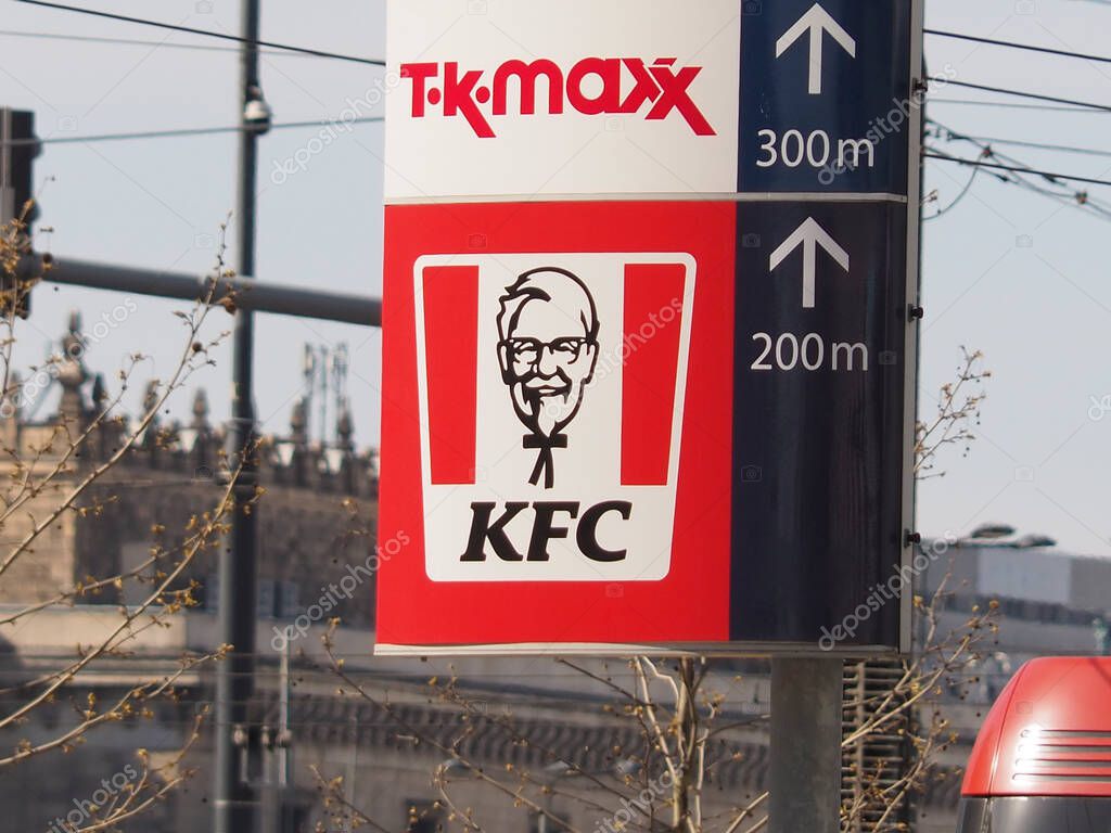 Directional Road Sign with TK Maxx and KFC Logos Showing Distances to Shopping Destinations