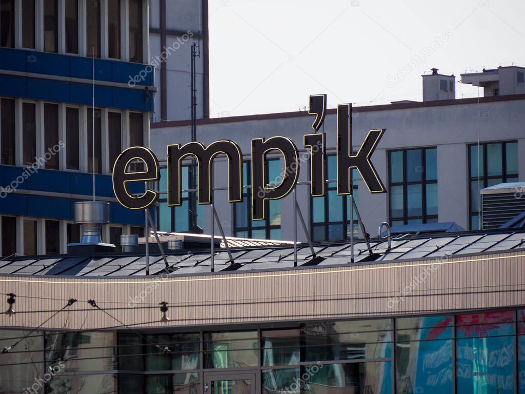 Empik Store Signage on Modern Shopping Center Facade Under Clear Blue Sky in Warsaw