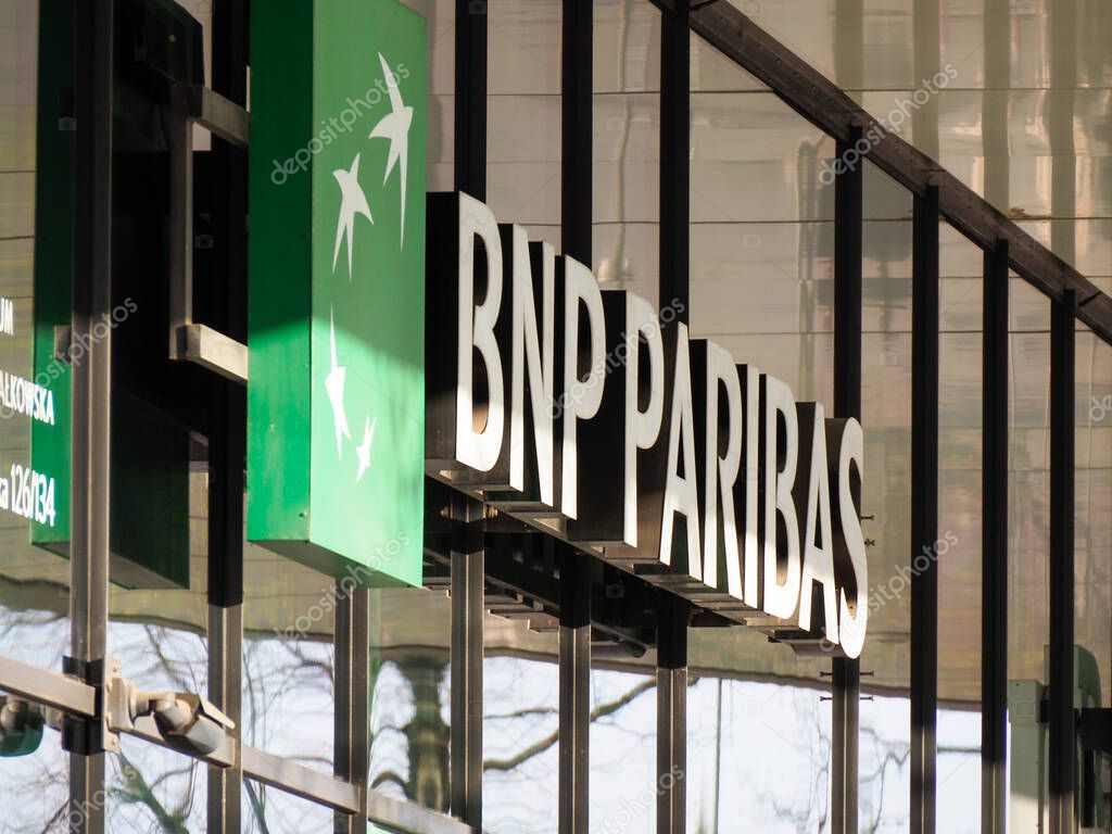 Close-up of BNP Paribas Bank Green Logo Sign on Modern Glass Building Facade in Urban Setting