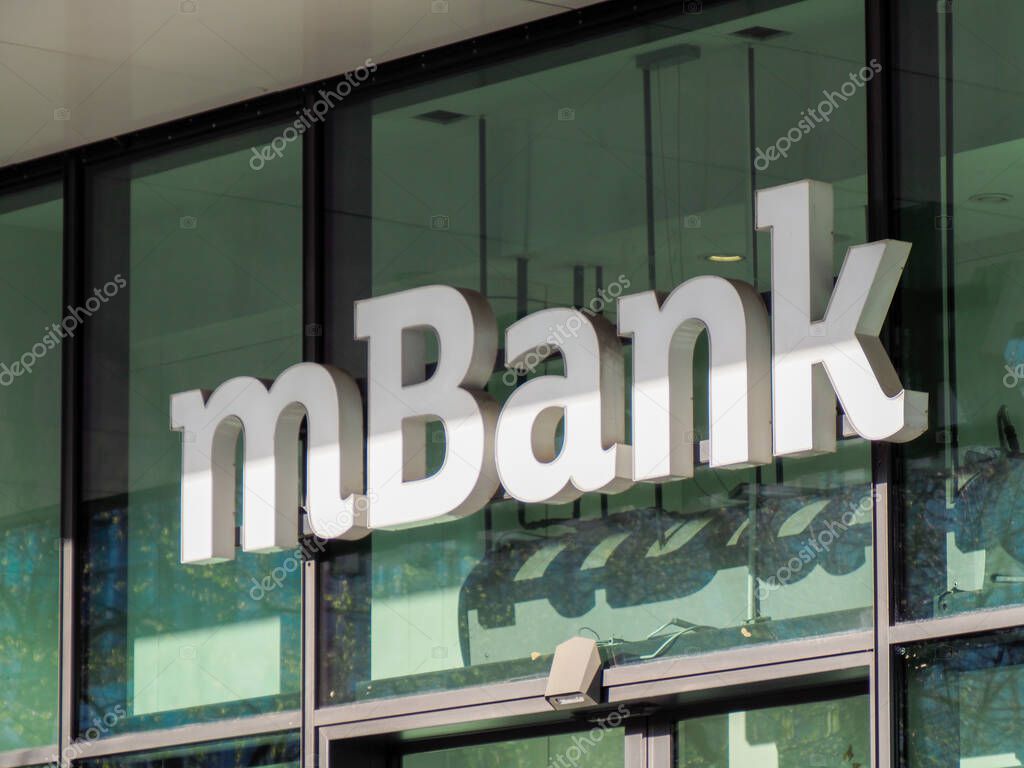 Detailed Close-Up Shot of mBank Logo on Modern Glass Building Facade in Urban Financial District