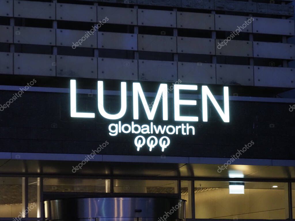 Illuminated LUMEN Globalworth Sign on Modern Corporate Building Facade at Night