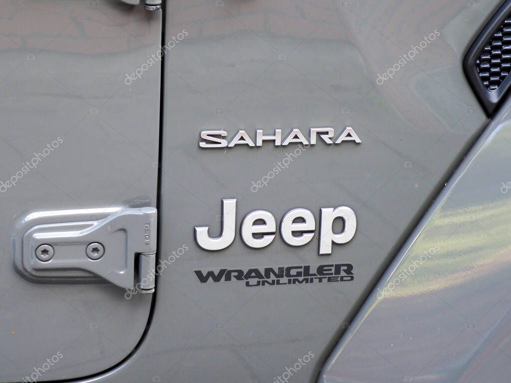 Close-up view of Jeep Wrangler Sahara edition logo and exterior details on silver vehicle