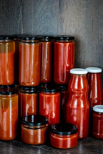 glass jars with homemade tomato sauce. High quality photo