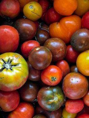 Colorful tomatoes of different sizes and kinds, top view. High quality photo