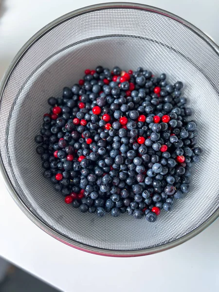 Ripe blueberries and cranberries for background, top view. High quality photo.