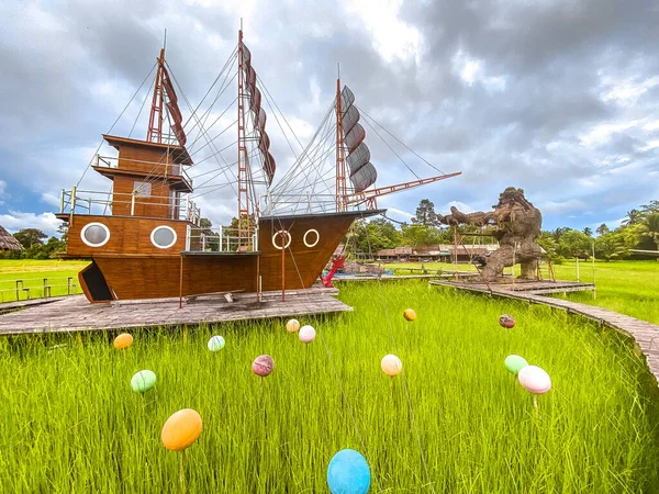 Sampaothai viewpoint, attraction park with a boat in rice fields, in Phattalaung, Thailand. High quality photo