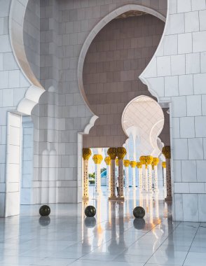 Sheikh Zayed Grand Mosque hallway corridor during sunset, in Abu Dhabi, United Arab Emirates. High quality photo