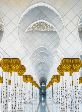 Sheikh Zayed Grand Mosque hallway corridor during sunset, in Abu Dhabi, United Arab Emirates. High quality photo