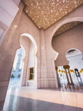 Sheikh Zayed Grand Mosque hallway corridor during sunset, in Abu Dhabi, United Arab Emirates. High quality photo