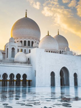 The Sheikh Zayed Grand Mosque during sunset, in Abu Dhabi, United Arab Emirates. High quality photo