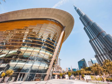 Dubai Opera house in Downtown Dubai, surrounded by skyscrapers and Burj Khalifa, in UAE, United Arab Emirates. High quality photo