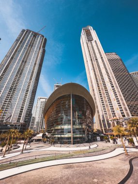 Dubai Opera house in Downtown Dubai, surrounded by skyscrapers and Burj Khalifa, in UAE, United Arab Emirates. High quality photo