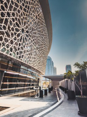 Dubai Opera house in Downtown Dubai, surrounded by skyscrapers and Burj Khalifa, in UAE, United Arab Emirates. High quality photo