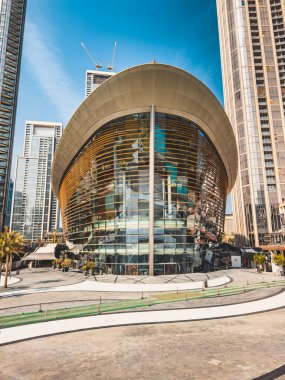 Dubai Opera house in Downtown Dubai, surrounded by skyscrapers and Burj Khalifa, in UAE, United Arab Emirates. High quality photo