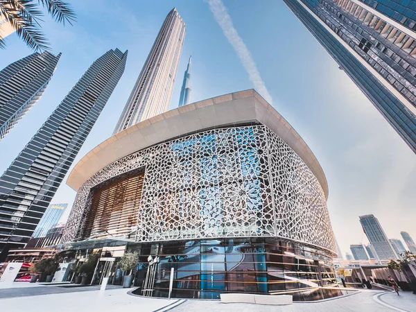 Dubai Opera house in Downtown Dubai, surrounded by skyscrapers and Burj Khalifa, in UAE, United Arab Emirates. High quality photo