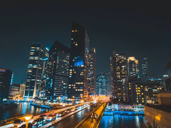 Stock image Dubai Marina, harbour, cruise boat and canal promenade view at night, in Dubai, United Arab Emirates. High quality photo