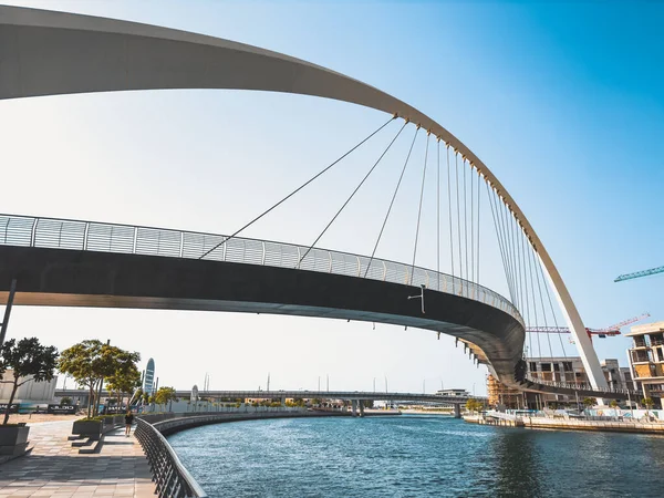 stock image Dubai Water Canal Tolerance Bridge, pedestrian bridge with water taxi, in Dubai, UAE. High quality photo