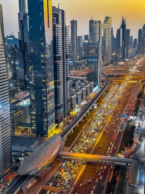 View of Sheikh Zayed Road at sunset in Dubai Downtown Financial center, UAE. High quality photo clipart