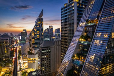 Aerial view of Ploenchit road by night in Bangkok Downtown, financial district and business center, Thailand, south east asia clipart