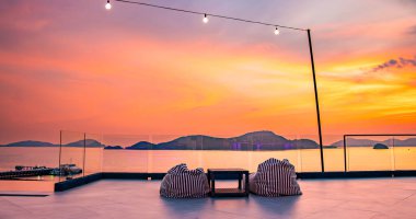View of rooftop bar in Panwa beach at sunset, in Phuket, Thailand, south east Asia clipart