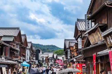 Okage Yokocho is a charming area with replica Edo period wooden buildings housing craft stores and restaurants. clipart