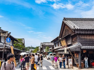 Okage Yokocho is a charming area with replica Edo period wooden buildings housing craft stores and restaurants. clipart