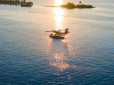 Aerial views of Velavaru Island at sunset in Maldives, Asia clipart