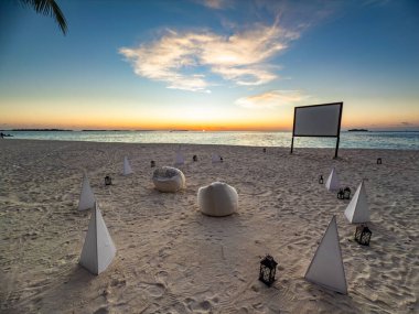 Private cinema on the beach in Maldives. High quality photo clipart