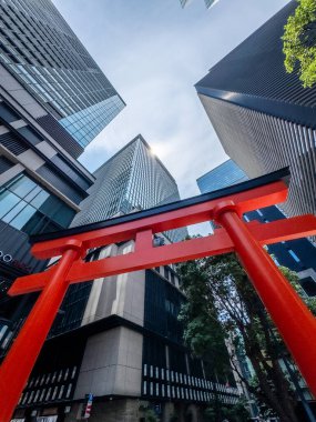 Fukutoku Shrine with view of skyscrapers in business center, Tokyo, Japan. High quality photo clipart