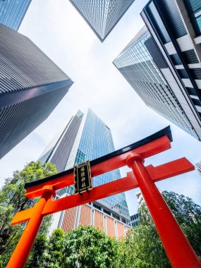 Fukutoku Shrine with view of skyscrapers in business center, Tokyo, Japan. High quality photo clipart