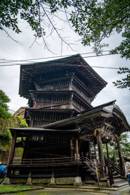 Sazae Temple. Wooden temple from 1796 with a unique double helix structure and a spiral staircase. clipart