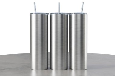 Three metal 20 oz skinny tumblers on the table. Straight 20 oz tumbler for sublimation. Thermo mug. 3d rendering clipart