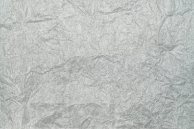 Beyaz buruşuk paket kağıdı dokusu, arka planda izole edilmiş. Kaba katlanmış yüzey ideal ambalaj, paketleme, el sanatları, yapıştırma kitabı, tasarım ve sanatsal projeler için.