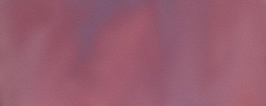 Yumuşak bir gradyanı olan desenli pembe bir yüzeyin detaylı yüksek çözünürlüklü fotoğrafı.