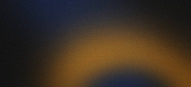 Kum tanecikli arkaplan maviden turuncuya doğru soluyor, kumlu bir dokusu var.