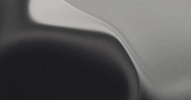 Siyah ve beyaz arasında pürüzsüz bir geçiş ile soyut şekiller oluşturan tahıl gradyanı, arkaplan ve grafik tasarım projeleri için ideal