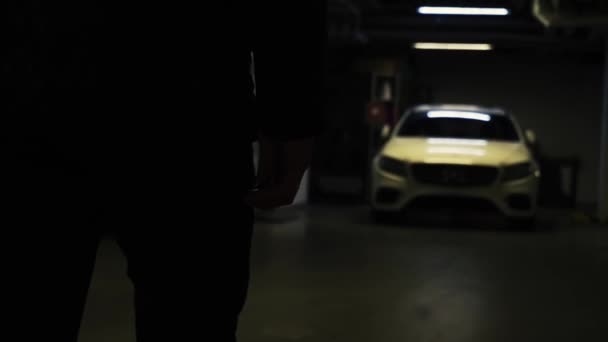 Silhouette Man Close Hand Car Keys Turning Alarm Dark Underground — Stock Video