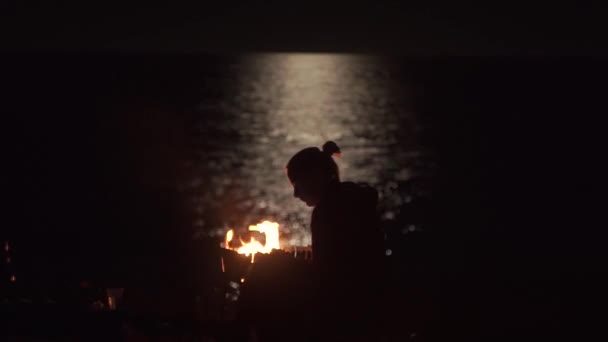 Young Lonely Girl Campsite Fire Beach Night Using Smartphone Background — Stock Video