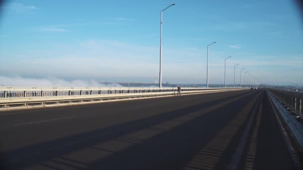 Male Athlete Slowly Confidently Runs Marathon Empty Road Bridge Practicing — Stockvideo