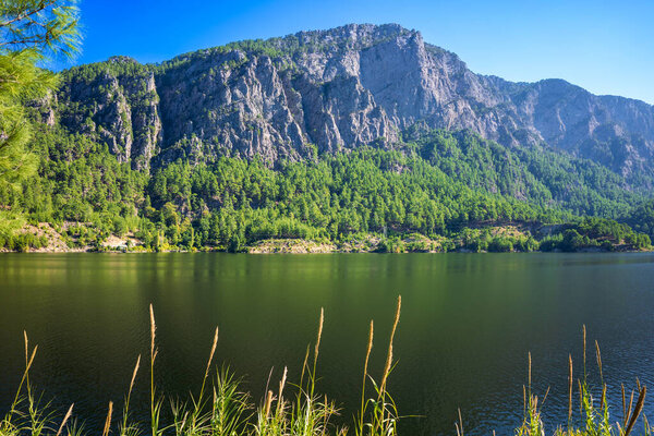 Beautiful lake with amazing view among mountains and greenery